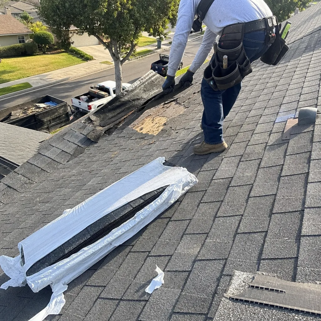 Professional roofer performing shingle replacement and roof deck repair